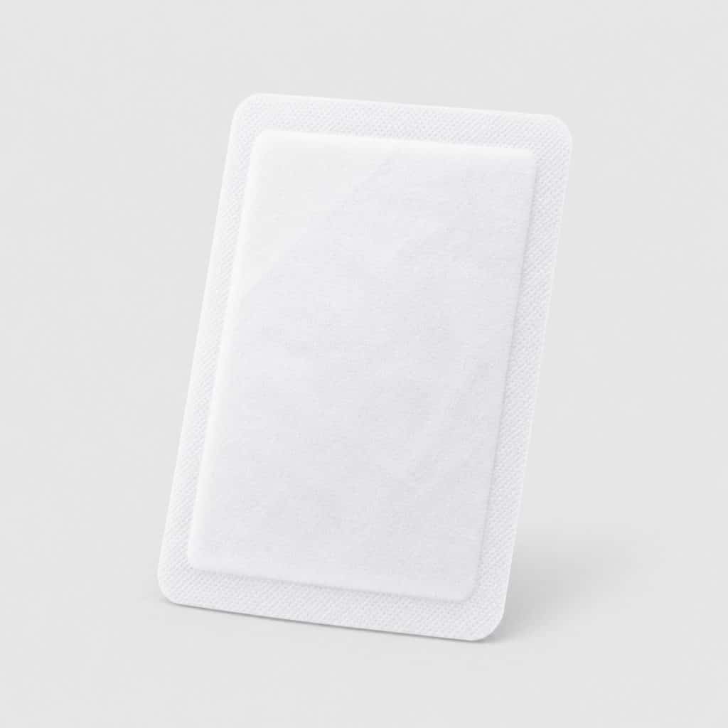 Patch chauffant autocollant posé seul sur fond neutre